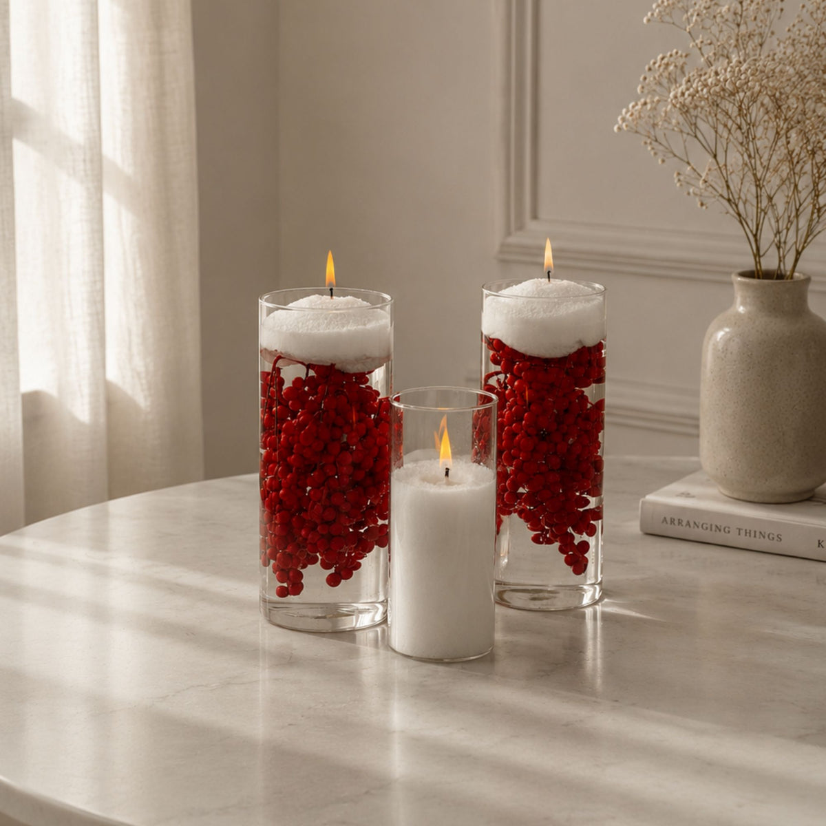 Set of 3 clear glass cylinder vases filled with white FLAMMÉ Candle Dust and lit wicks